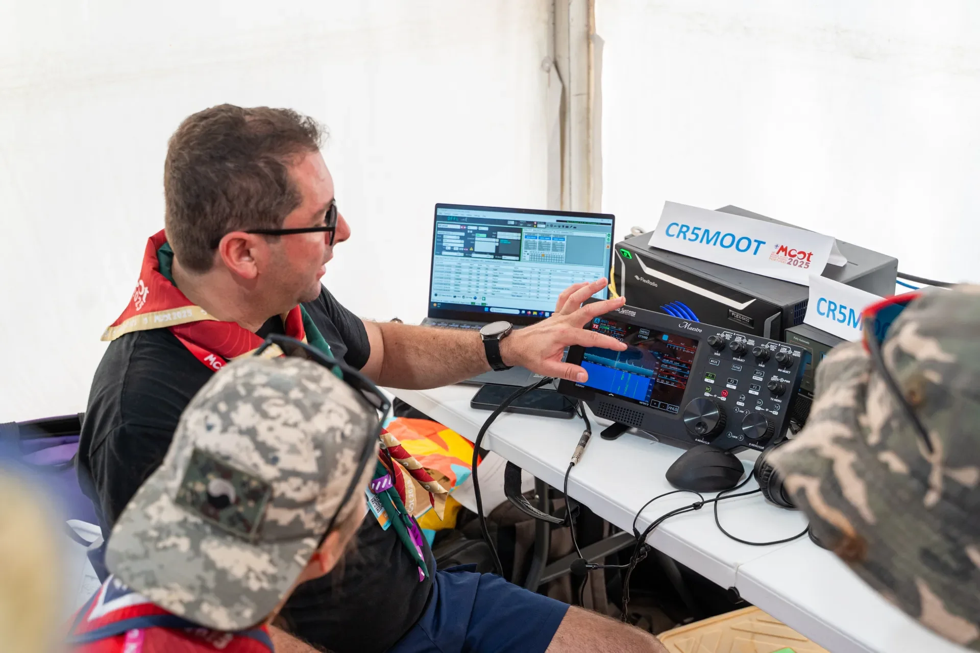 Scouts learning about Amateur Radio at the JOTA-JOTI booth at the World Scout Moot.