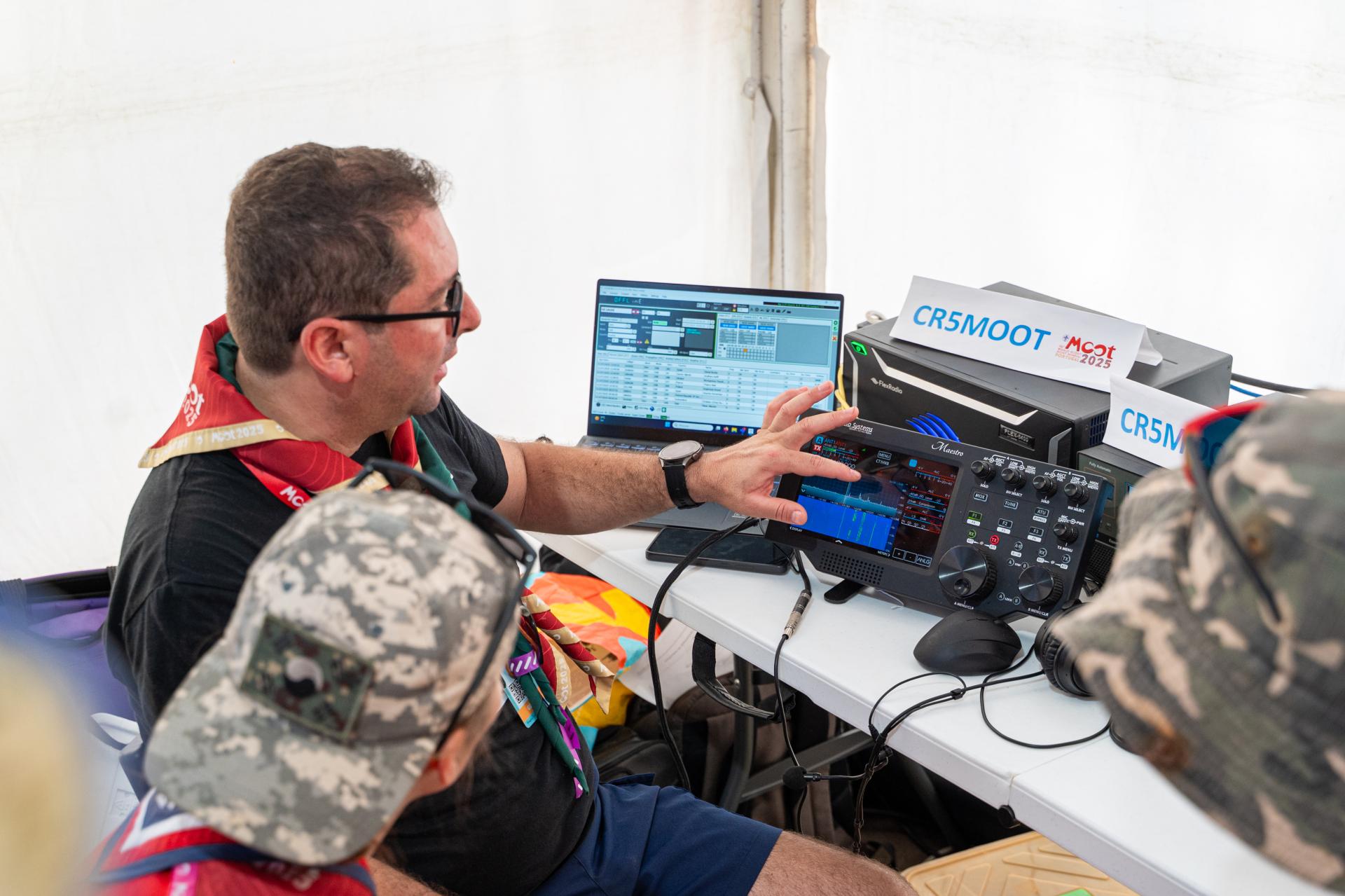 Scouts learning about Amateur Radio at the JOTA-JOTI booth at the World Scout Moot.